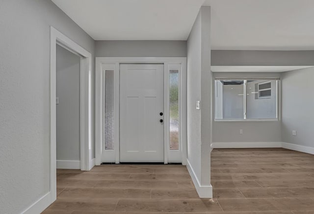 18228 48th Ave N, The Acreage, FL 33470 - foyer entrance with wood finished floors and baseboards