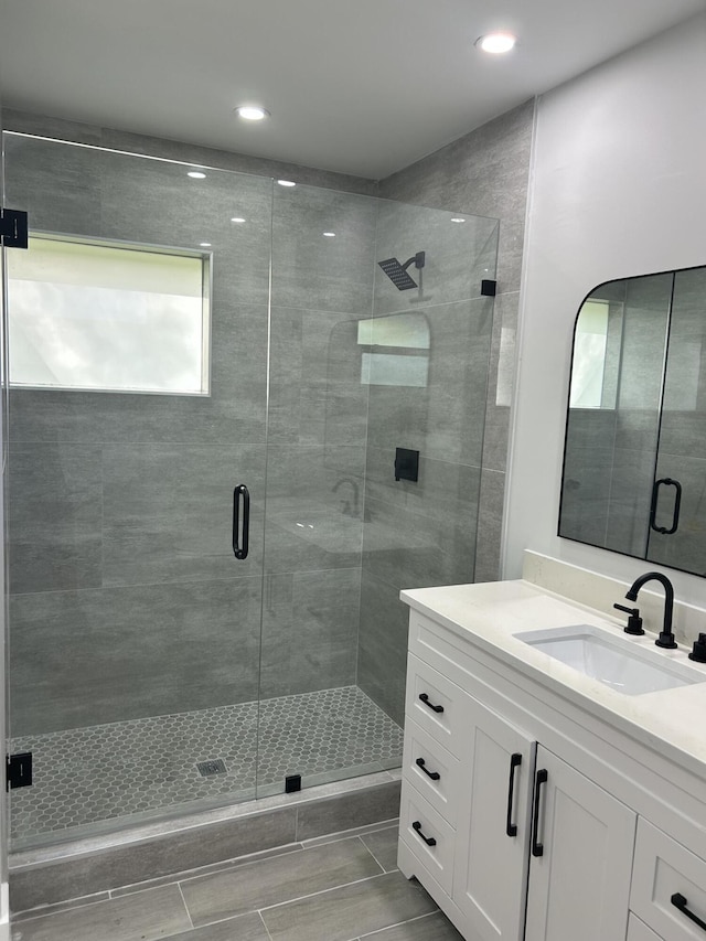18228 48th Ave N, The Acreage, FL 33470 - full bathroom featuring vanity, a stall shower, and recessed lighting