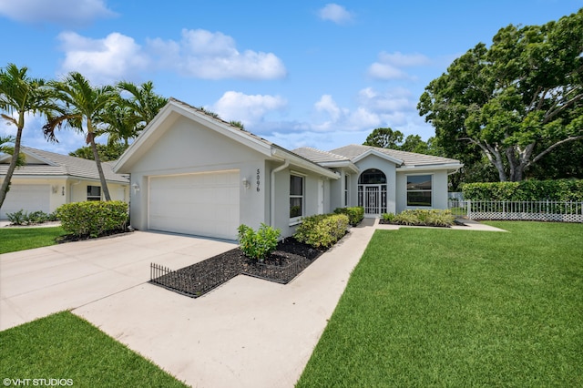 5096 SE Sweetbrier Ter, Hobe Sound, FL 33455 - single story home featuring a garage, concrete driveway, stucco siding, and a tile roof