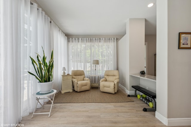 5096 SE Sweetbrier Ter, Hobe Sound, FL 33455 - living area with wood finished floors and baseboards