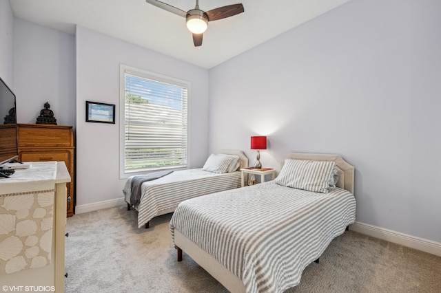 5096 SE Sweetbrier Ter, Hobe Sound, FL 33455 - bedroom with light carpet, baseboards, and a ceiling fan