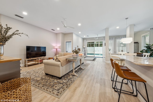 5096 SE Sweetbrier Ter, Hobe Sound, FL 33455 - living room with ceiling fan, light wood-type flooring, recessed lighting, and baseboards