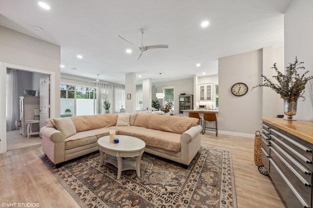 5096 SE Sweetbrier Ter, Hobe Sound, FL 33455 - living room featuring light wood-style flooring, a ceiling fan, recessed lighting, and baseboards