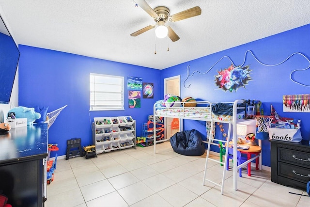 1430 SE Ocean Ln, Port Saint Lucie, FL 34983 - tiled bedroom with a textured ceiling and a ceiling fan