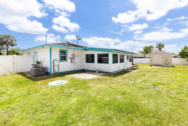 1430 SE Ocean Ln, Port Saint Lucie, FL 34983 - back of house featuring central AC, roof mounted solar panels, and a patio area