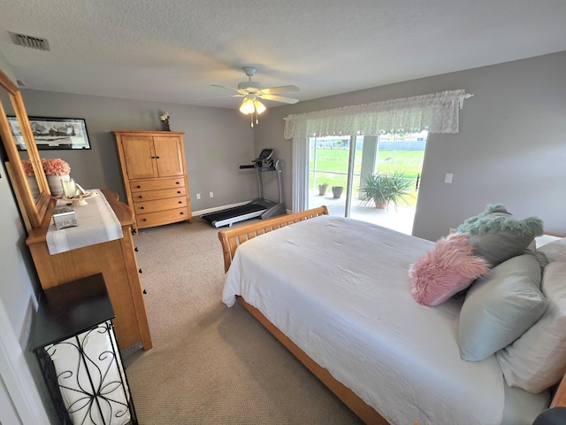 5237 NW Milner Dr, Port Saint Lucie, FL 34983 - carpeted bedroom featuring access to outside and ceiling fan