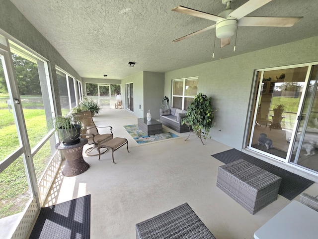 5237 NW Milner Dr, Port Saint Lucie, FL 34983 - sunroom / solarium featuring a ceiling fan and outdoor lounge area