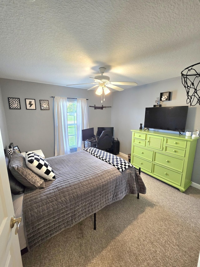 5237 NW Milner Dr, Port Saint Lucie, FL 34983 - bedroom with light carpet, baseboards, ceiling fan, and a textured ceiling