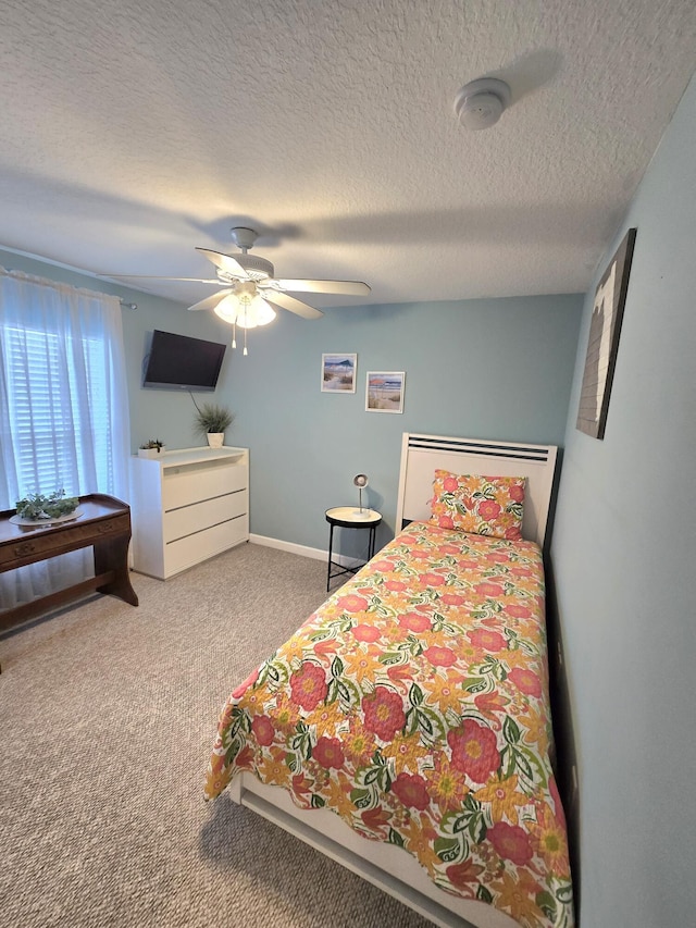 5237 NW Milner Dr, Port Saint Lucie, FL 34983 - carpeted bedroom featuring a ceiling fan, baseboards, and a textured ceiling