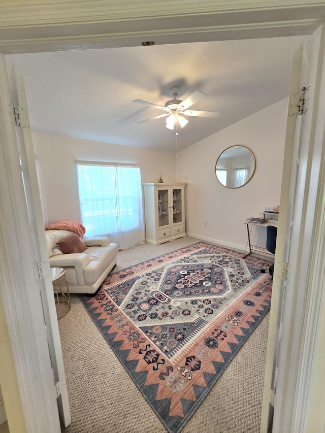 5237 NW Milner Dr, Port Saint Lucie, FL 34983 - living area featuring carpet, ceiling fan, and baseboards