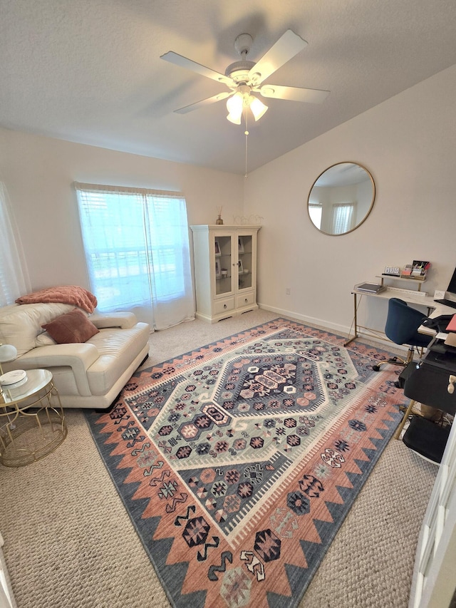5237 NW Milner Dr, Port Saint Lucie, FL 34983 - living room with ceiling fan, light colored carpet, and baseboards