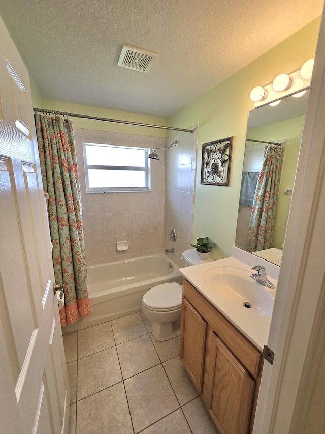 5237 NW Milner Dr, Port Saint Lucie, FL 34983 - bathroom featuring shower / bath combo, vanity, tile patterned flooring, toilet, and a textured ceiling