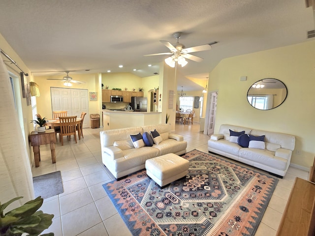 5237 NW Milner Dr, Port Saint Lucie, FL 34983 - living area with a ceiling fan, light tile patterned flooring, and lofted ceiling