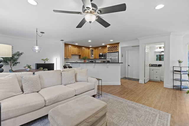 23 Lexington Ln W Unit A, Palm Beach Gardens, FL 33418 - living room featuring ceiling fan, recessed lighting, light wood finished floors, crown molding, and baseboards