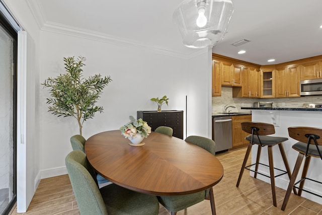 23 Lexington Ln W Unit A, Palm Beach Gardens, FL 33418 - dining area with light wood finished floors, ornamental molding, recessed lighting, and baseboards