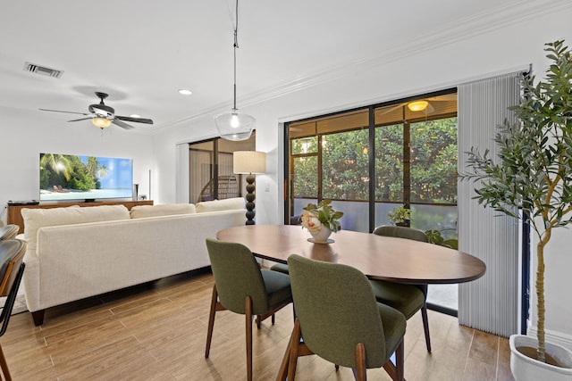 23 Lexington Ln W Unit A, Palm Beach Gardens, FL 33418 - dining room with ornamental molding, light wood finished floors, ceiling fan, and recessed lighting