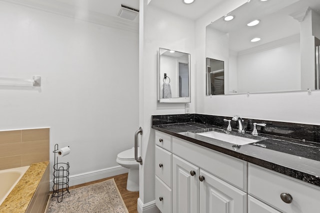 23 Lexington Ln W Unit A, Palm Beach Gardens, FL 33418 - full bathroom featuring vanity, a garden tub, baseboards, wood finished floors, and recessed lighting