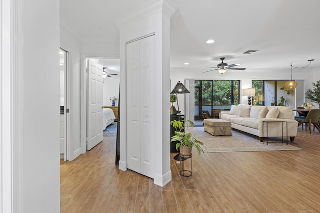 23 Lexington Ln W Unit A, Palm Beach Gardens, FL 33418 - living room featuring ornamental molding, a ceiling fan, light wood-type flooring, recessed lighting, and baseboards