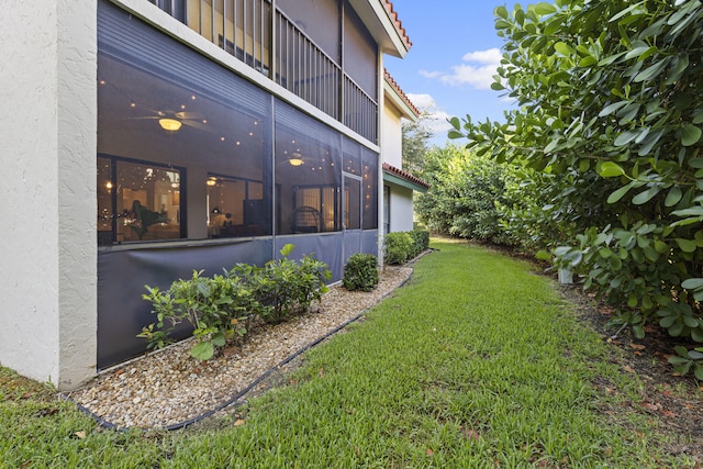 23 Lexington Ln W Unit A, Palm Beach Gardens, FL 33418 - view of grassy yard featuring a balcony and a ceiling fan