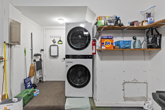 23 Lexington Ln W Unit A, Palm Beach Gardens, FL 33418 - laundry area featuring estacked washer and dryer, electric panel, and carpet