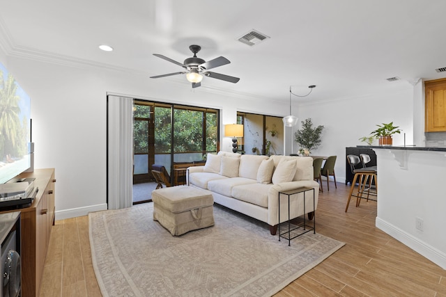 23 Lexington Ln W Unit A, Palm Beach Gardens, FL 33418 - living room featuring crown molding, baseboards, a ceiling fan, light wood finished floors, and recessed lighting