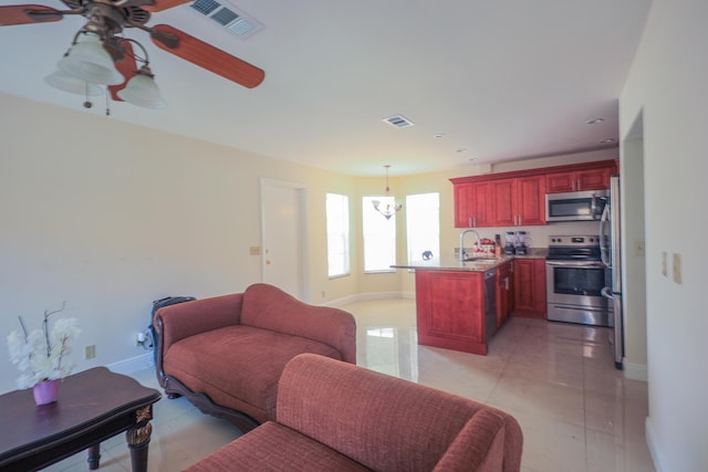1356 N Climbing Rose, West Palm Beach, FL 33415 - living room with a ceiling fan and baseboards