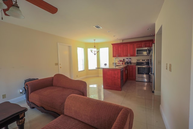 1356 N Climbing Rose, West Palm Beach, FL 33415 - living room with baseboards, ceiling fan, and recessed lighting