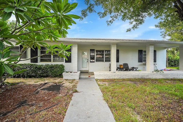 1331 S Palmway, Lake Worth Beach, FL 33460 - entrance to property featuring stucco siding and covered porch