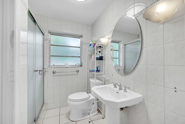 1331 S Palmway, Lake Worth Beach, FL 33460 - full bath featuring tile walls, a shower stall, tile patterned flooring, and toilet