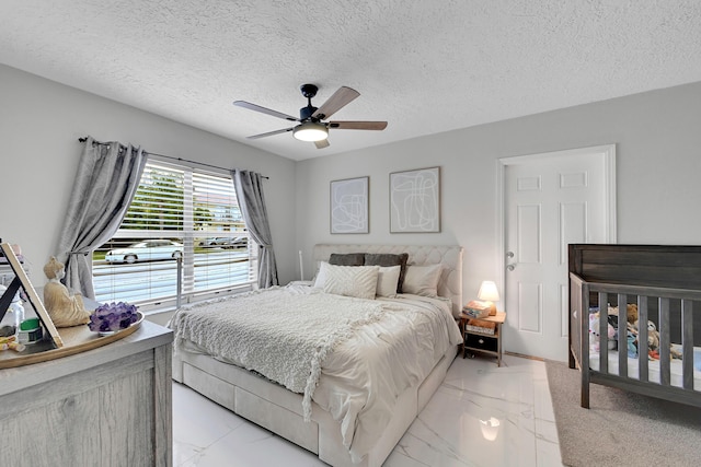 1331 S Palmway, Lake Worth Beach, FL 33460 - bedroom featuring light marble finish flooring, a textured ceiling, and a ceiling fan