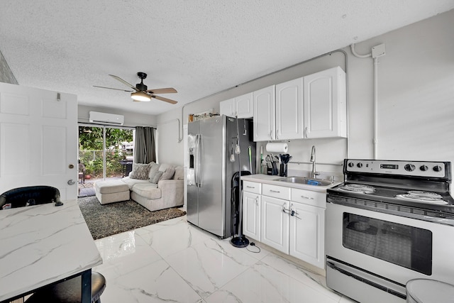 1331 S Palmway, Lake Worth Beach, FL 33460 - kitchen with appliances with stainless steel finishes, a sink, an AC wall unit, open floor plan, and ceiling fan