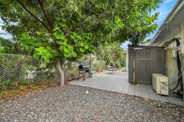 1331 S Palmway, Lake Worth Beach, FL 33460 - fenced backyard featuring area for grilling, a cooling unit, and a patio area
