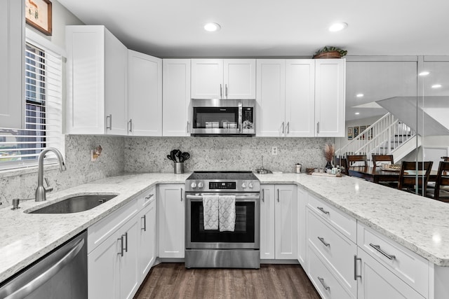 9300 SW 61st Way Unit A, Boca Raton, FL 33428 - kitchen with appliances with stainless steel finishes, a sink, white cabinets, and recessed lighting