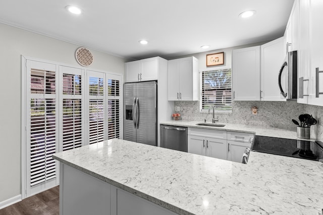 9300 SW 61st Way Unit A, Boca Raton, FL 33428 - kitchen featuring stainless steel appliances, a sink, light stone counters, decorative backsplash, and recessed lighting