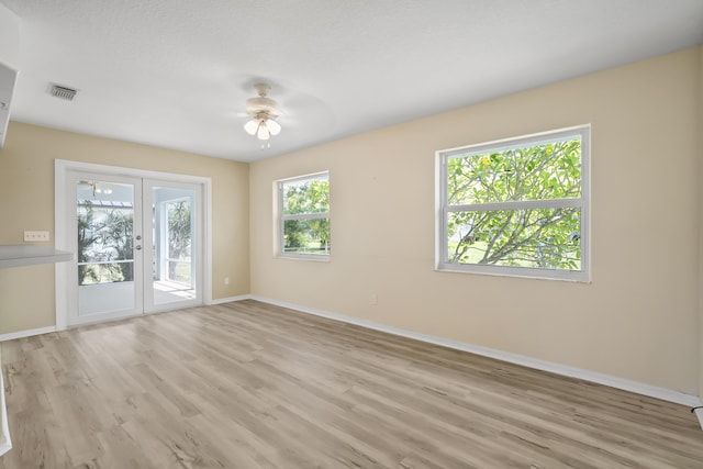 3048 SE Wake Rd, Port Saint Lucie, FL 34984 - unfurnished room featuring baseboards, light wood-style flooring, and ceiling fan