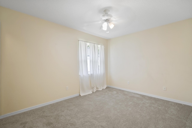3048 SE Wake Rd, Port Saint Lucie, FL 34984 - carpeted empty room featuring baseboards and a ceiling fan