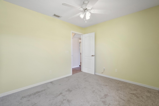 3048 SE Wake Rd, Port Saint Lucie, FL 34984 - carpeted spare room featuring a ceiling fan and baseboards
