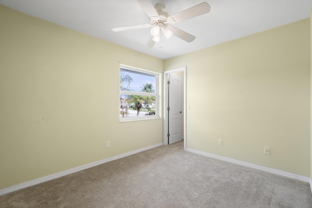 3048 SE Wake Rd, Port Saint Lucie, FL 34984 - carpeted spare room with baseboards and ceiling fan