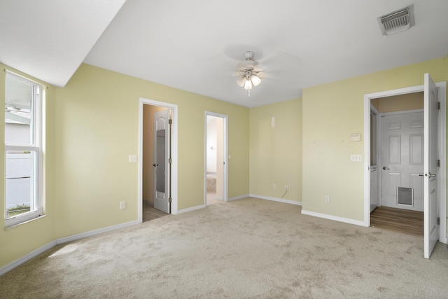 3048 SE Wake Rd, Port Saint Lucie, FL 34984 - unfurnished bedroom with carpet flooring, baseboards, and multiple windows