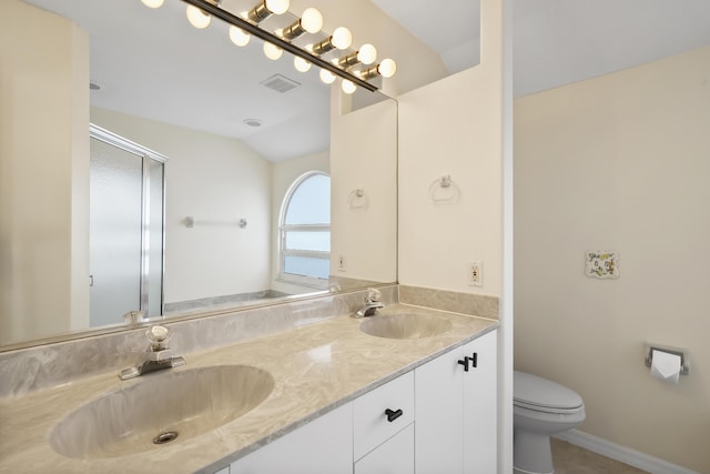 3048 SE Wake Rd, Port Saint Lucie, FL 34984 - bathroom featuring toilet, double vanity, a shower with door, and vaulted ceiling