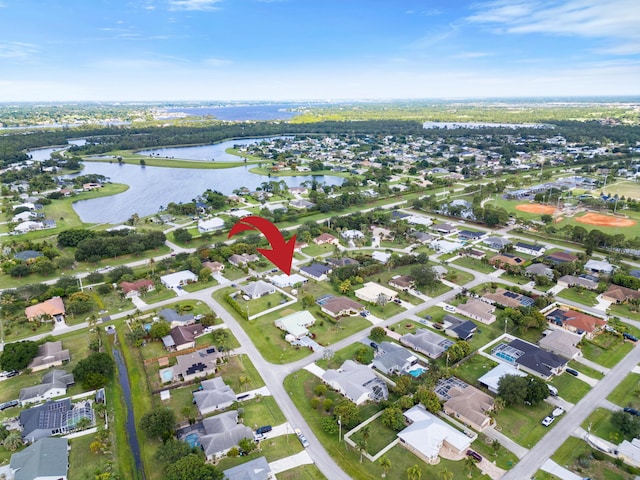 3048 SE Wake Rd, Port Saint Lucie, FL 34984 - aerial view of property's location featuring a large body of water and nearby suburban area