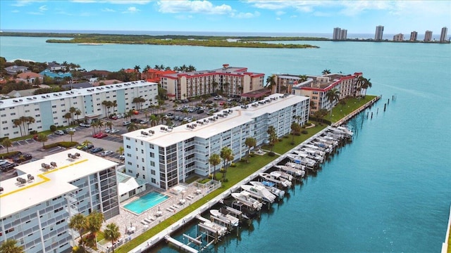 104 Paradise Harbour Blvd Unit 104, North Palm Beach, FL 33408 - view of urban area with apartment complex, a nearby body of water, and a pool area