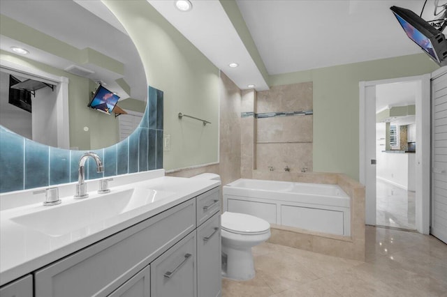 104 Paradise Harbour Blvd Unit 104, North Palm Beach, FL 33408 - bathroom with a tub, vanity, toilet, recessed lighting, and tile patterned floors
