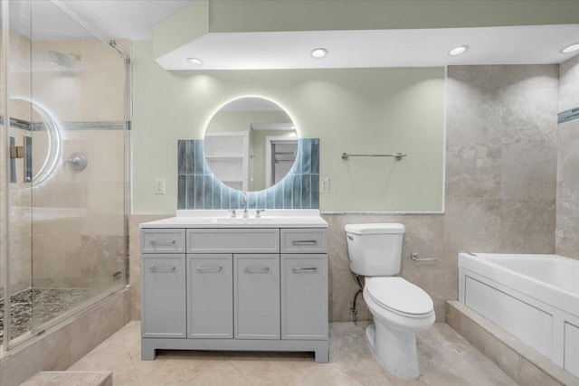 104 Paradise Harbour Blvd Unit 104, North Palm Beach, FL 33408 - bathroom with tile walls, tiled shower, tile patterned floors, vanity, and toilet