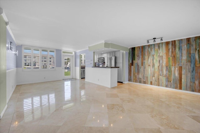 104 Paradise Harbour Blvd Unit 104, North Palm Beach, FL 33408 - unfurnished living room with baseboards