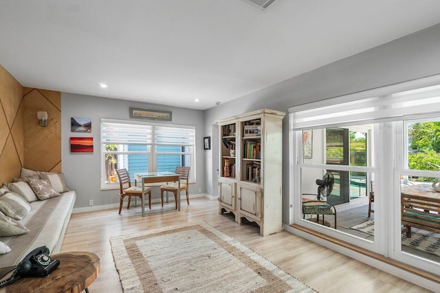 1222 N Palmway, Lake Worth Beach, FL 33460 - living area featuring light wood-style flooring, baseboards, and recessed lighting