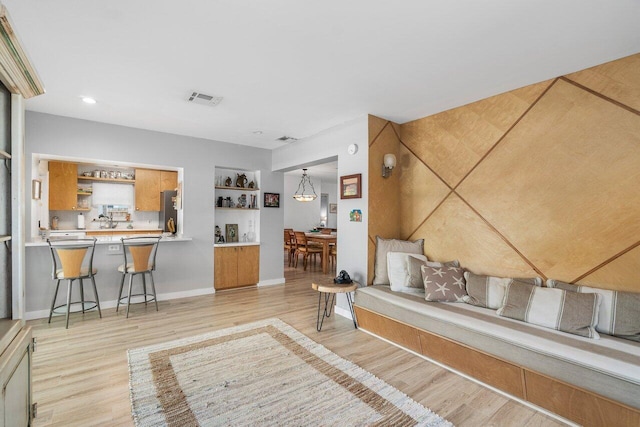 1222 N Palmway, Lake Worth Beach, FL 33460 - living room featuring light wood-type flooring, baseboards, recessed lighting, and bar