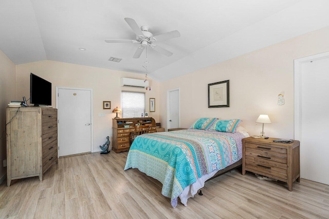 1222 N Palmway, Lake Worth Beach, FL 33460 - bedroom with a wall mounted AC, lofted ceiling, light wood-type flooring, and a ceiling fan