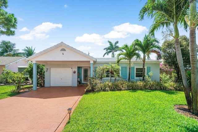 1222 N Palmway, Lake Worth Beach, FL 33460 - single story home with stucco siding, a front lawn, decorative driveway, and an attached garage