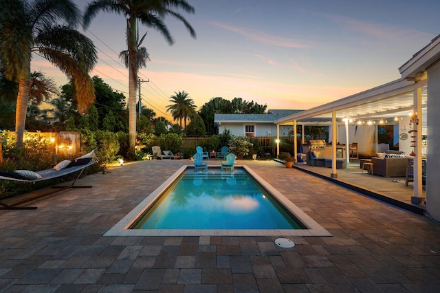 1222 N Palmway, Lake Worth Beach, FL 33460 - pool at dusk with a patio